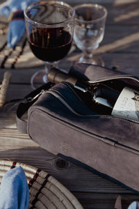 Open bag with bottle of wine peeping out